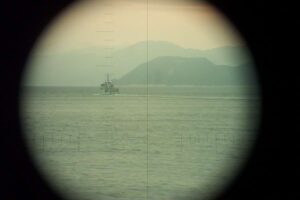   Mercuur seen through the periscope of  Dolfijn. Norway, between 5 and 7 Apr 2003. As most periscope shots this photo is taking with a standard digital camera which is held in front of the eye piece of the scope. (Photo: © Official Dolfijn website). 