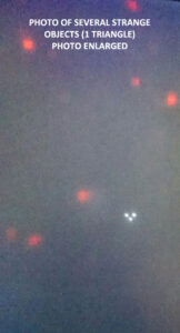 Man Finds Flying Triangle UFO & Other Red Lights in Photo