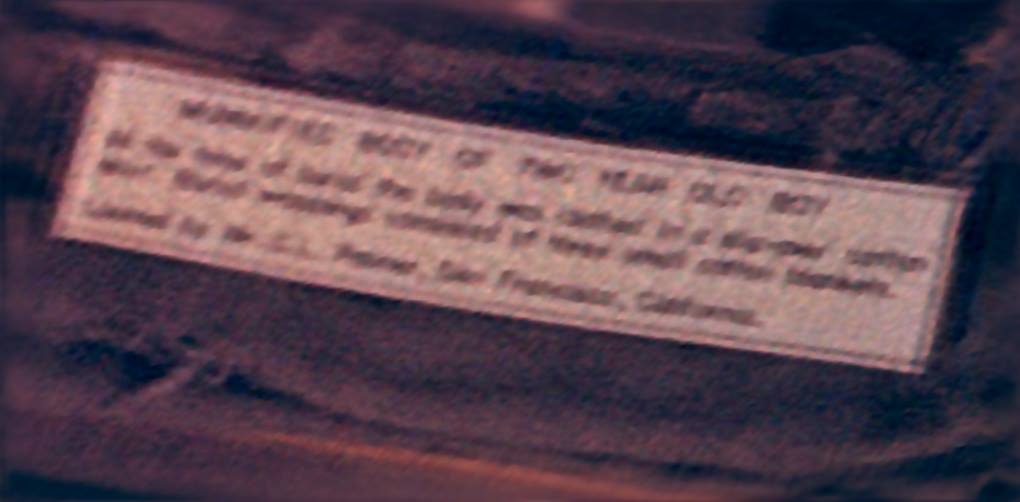 After a "deblur" process is run on the high resolution version of the slide, my theory proposed above was correct that it could be decoded with sophisticated software, and a skilled computer technician. The result? As shown here, "Mummified Body of Two Year Old Boy."