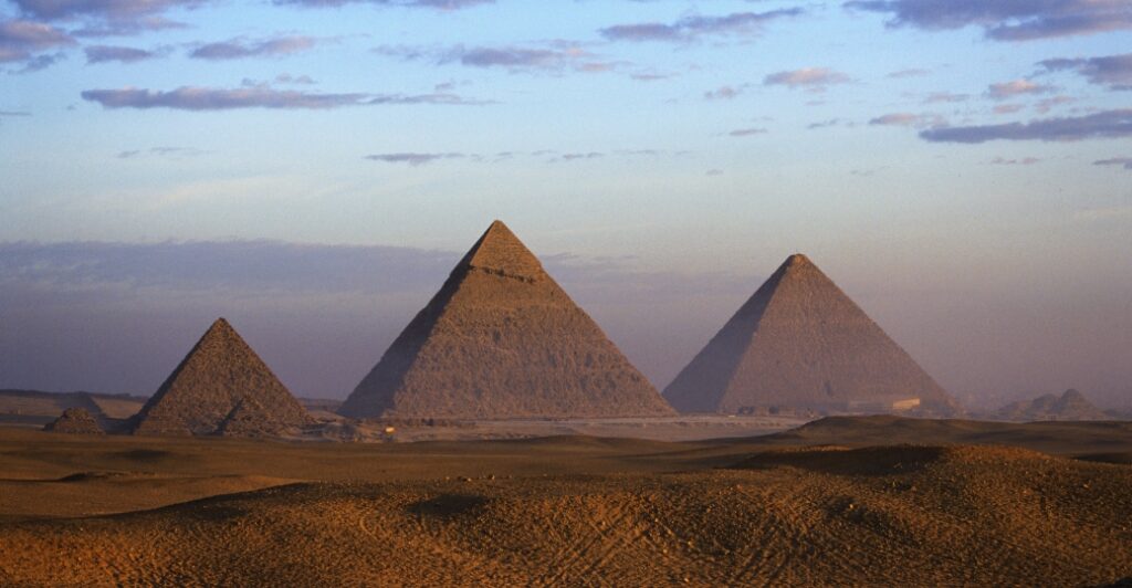 The pyramids of Menkaure, Khafre and Khufu (from left), erected on the west bank of the Nile River. Built between 2575-2465 BCE to serve as burial monuments for three Egyptian kings, they were included among the Seven Wonders of the Ancient World.