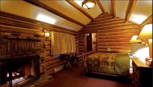 Although not an exact match, it's pretty close. This is one of the lodges available, and although we don't have access to a photo of each and every lodge, my guess, is one of the lodges as the lamp above in the room.