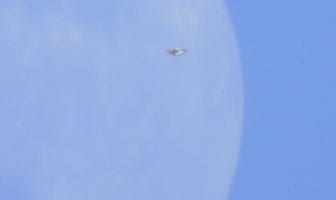 UFO Appears Over Cornwall, Ontario Canada, While Witness Photographs Moon
