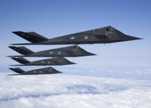 Four F-117 Nighthawks fly in formation during a sortie over the Antelope Valley recently. After 25 years of history, the aircraft is set to retire soon. As the Air Force's first stealth fighter, the F-117 is capable of performing reconnaissance missions and bombing critical targets, all without the enemy's knowledge. (Photo by Bobbi Zapka)