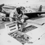 Tuskeegee Airman Reloads a P-51